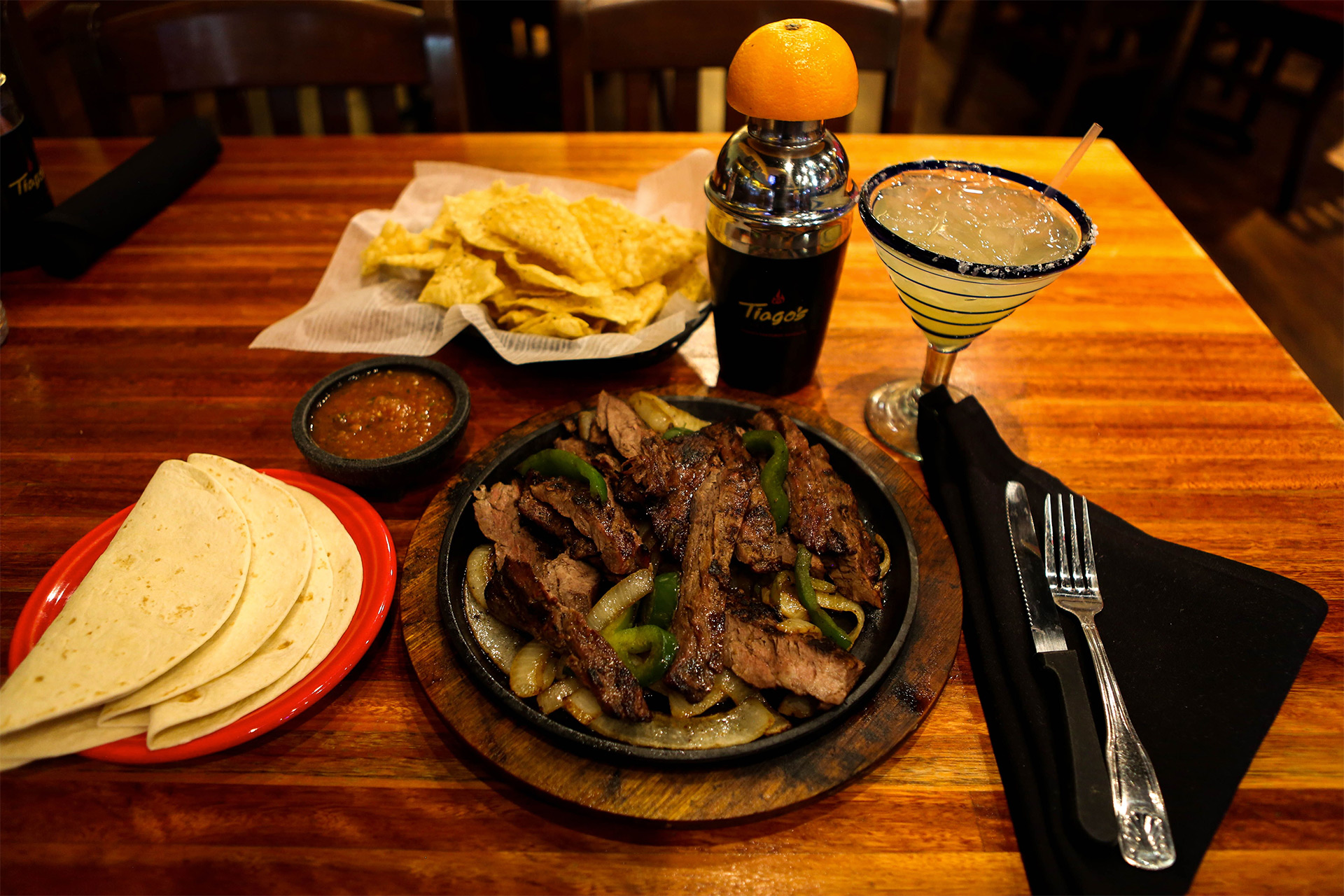 Wood-fired plates and shareable appetizers for a group table at Tiago's